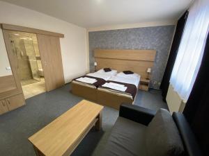 Postel nebo postele na pokoji v ubytování Hotel Zebetinsky Dvur Brno