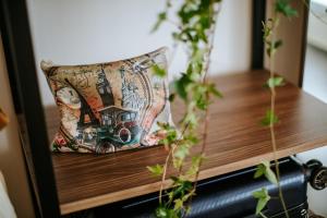 a pillow on a table with plants at Cosmo Napa Boutique Hotel in Ayia Napa