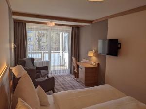 TV a/nebo společenská místnost v ubytování Hotel Germania