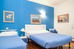 Postel nebo postele na pokoji v ubytování Lia Rooms