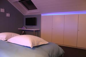 Letto o letti in una camera di B&B Au coin des sources
