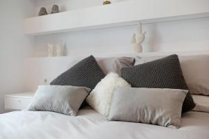 Łóżko lub łóżka w pokoju w obiekcie Apartamento Sol - Sólo Familias
