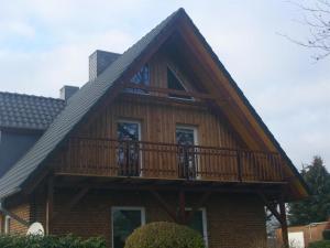 a house with a deck on the side of it at Ruschmeyer in Soltau