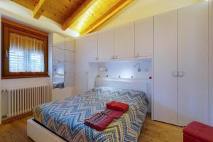Posteľ alebo postele v izbe v ubytovaní Mansarda con giardino Val di Sole Trentino