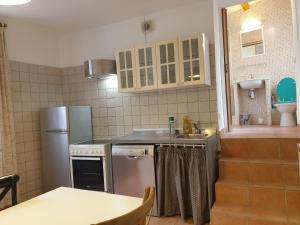 Kuchyň nebo kuchyňský kout v ubytování Appartements de l'Eglise