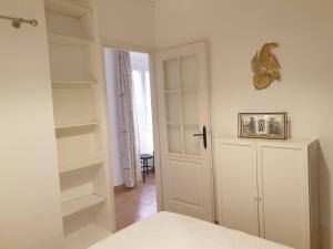 Postel nebo postele na pokoji v ubytování Appartements de l'Eglise