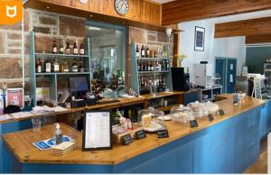 a bar in a store with a counter with alcohol at No42 Wild Goose in Dornoch