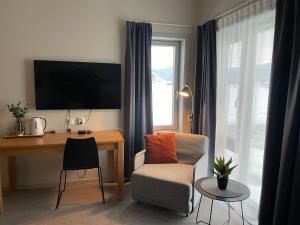 TV a/nebo společenská místnost v ubytování Fjellfolkets Hus