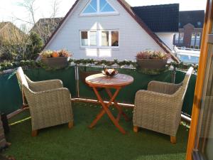 a patio with a table and two chairs and a table at Habichtsnest in Havixbeck