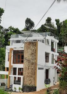 a large white building with a large rock at GAMPOLA Hazelton Square in Gampola