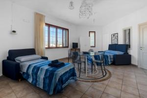 a living room with a couch and a table at Apartments Alba Lilia - Puglia Salento in Nociglia