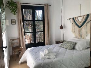 Postel nebo postele na pokoji v ubytování Casa Guidai
