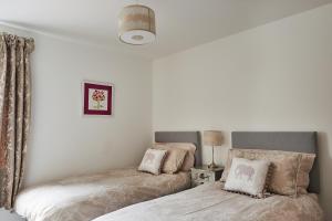 Ένα ή περισσότερα κρεβάτια σε δωμάτιο στο Aviemore apartment (pet friendly) - sleeps 4