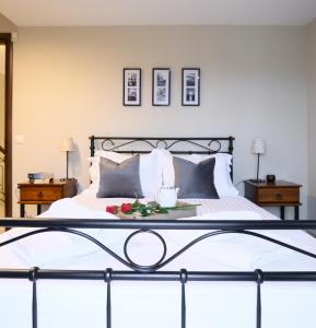 a bedroom with a bed with a tray of food on it at Villa Belvedere in Alexandroupoli