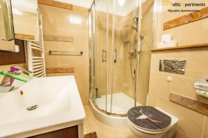 Koupelna v ubytování Baltic Apartments - Stella Baltic + 74 fotografií