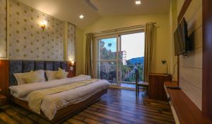 a bedroom with a bed and a large window at Hotel Le Halcyon Kasauli in Solan