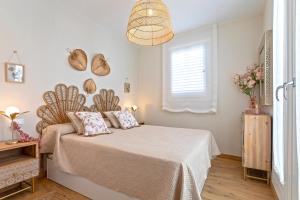 En eller flere senge i et værelse på Genteel Home Mercado Central Terrace