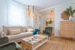 a living room with a couch and two chairs at Genteel Home Mercado Central Terrace in Cádiz