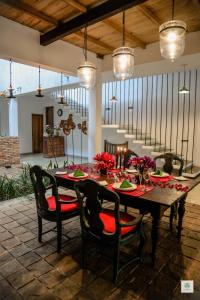 a dining room with a table and chairs at GODDESS Kandy in Kandy