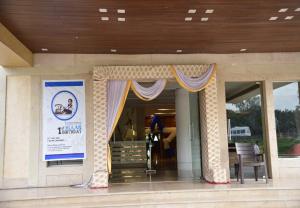 a store front with curtains and a sign on it at Rang Lords Inn Bharuch in Bharuch
