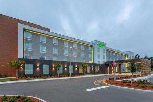 a hotel building with a street in front of it at Wyndham Garden Orlando Airport - Free Airport Shuttle - PARK N' FLY Available in Orlando