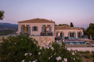 a villa with a view of a house at Villa Benedetta Unique Privacy And Sea View in Sivota