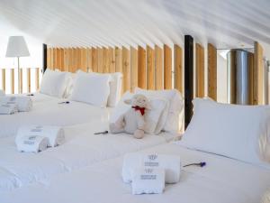מיטה או מיטות בחדר ב-Residentas Sao Pedro