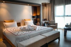 Letto o letti in una camera di DWO Mira Palace