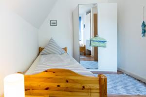 Ein Bett oder Betten in einem Zimmer der Unterkunft Ferienhaus Seestern