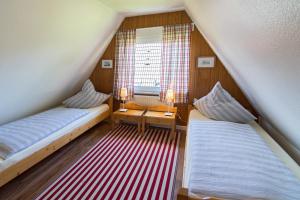 Ein Bett oder Betten in einem Zimmer der Unterkunft Ferienhaus Seestern