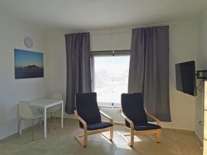 TV a/nebo společenská místnost v ubytování Apartamentos Anjomacar B
