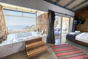 A bed or beds in a room at Ölüdeniz Loft - Adults Only