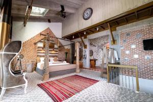 A bed or beds in a room at Ölüdeniz Loft - Adults Only
