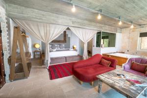 A bed or beds in a room at Ölüdeniz Loft - Adults Only