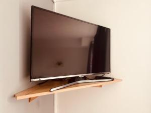 a flat screen tv hanging on a wall at Sneyd Arms Hotel Tunstall in Chatterley