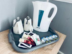 a tray on a table with a tea pot and a blender at Sneyd Arms Hotel Tunstall in Chatterley