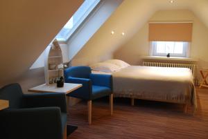 Postel nebo postele na pokoji v ubytování Hotel Rubens
