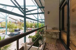 
a building that has a window over it at Fremantle Terrace Charming Townhouse in Perth
