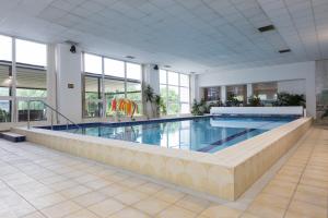 a large swimming pool in a building at Villa Barbara in Jaworze