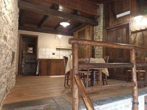 a room with a table and chairs in a building at Ca' de Baci' du Mattu in Mendatica
