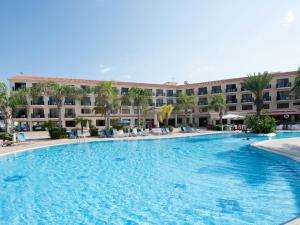 a large swimming pool in front of a hotel at Anmaria Beach Hotel & Spa in Ayia Napa