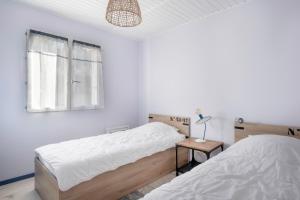 En eller flere senge i et værelse på À moins de 300m de la mer, maison cosy pour 4