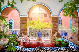 a living room with a couch in front of a building at Riad Persephone in Marrakesh