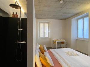 Säng eller sängar i ett rum på Casa Vino e Birra Boutique Guesthouse