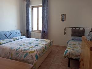 Posteľ alebo postele v izbe v ubytovaní Casa al Mare Fontespina
