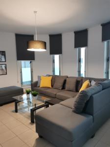 a living room with a couch and a table at City Flats 308 in Larnaca