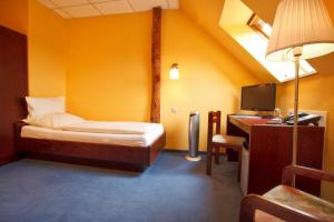 Cama ou camas em um quarto em Landhotel Zum Pottkuchen