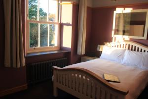 En eller flere senge i et værelse på Ellenboro House Bed & Breakfast & self-catering
