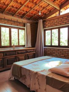 Cama ou camas em um quarto em Lilás Hospedagem e Terapias