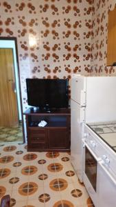 Kuchyň nebo kuchyňský kout v ubytování Casa vacanze Luisa + 7 fotografií